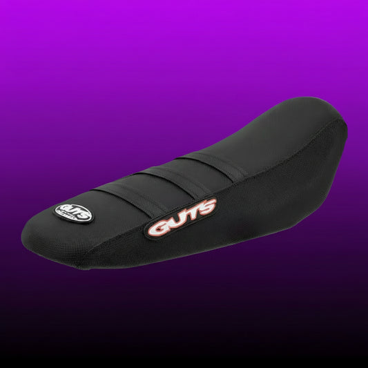 Black motorcycle seat with 'Guts' branding on a white background
