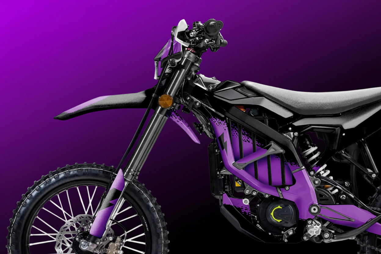 Purple and black dirt bike on a white background